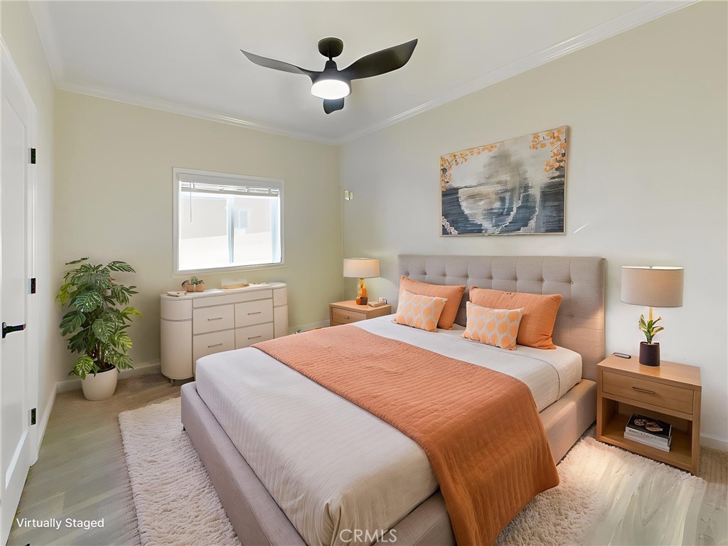 12530 Royal Road, Unit 46 El Cajon, CA 92021 - Photo 8 of 17 a bedroom with a large bed and a chandelier