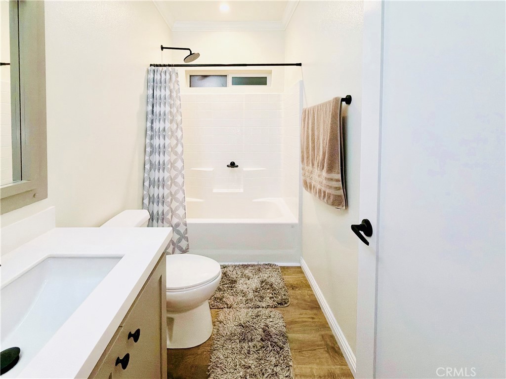 12530 Royal Road, Unit 46 El Cajon, CA 92021 - Photo 10 of 17 a bathroom with a sink a toilet a window and shower