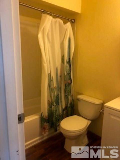 1408 East 9th Street, Unit 2 Reno, NV 89512 - Photo 8 of 10 a bathroom with a toilet and shower