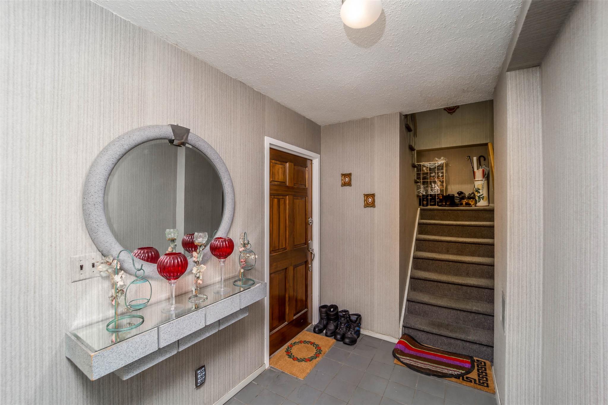 509 Julius Road Queens, NY 11356 - Photo 20 of 26 Tiled foyer with a textured ceiling and stairway