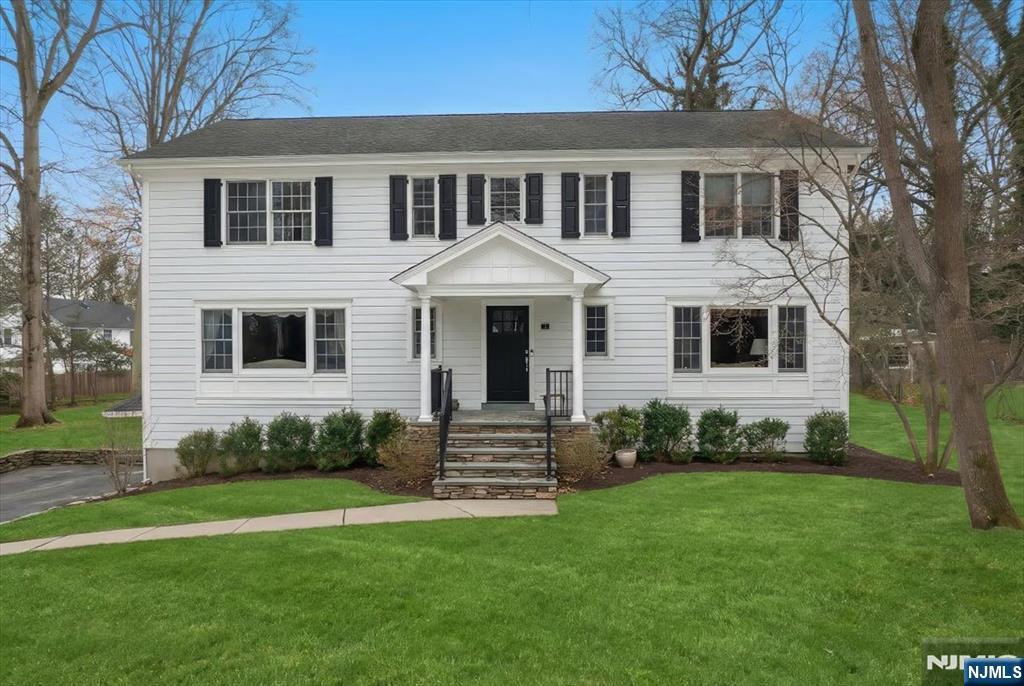 4 Lindeman Avenue Closter, NJ 07624 - Photo 1 of 36 a front view of a house with a garden