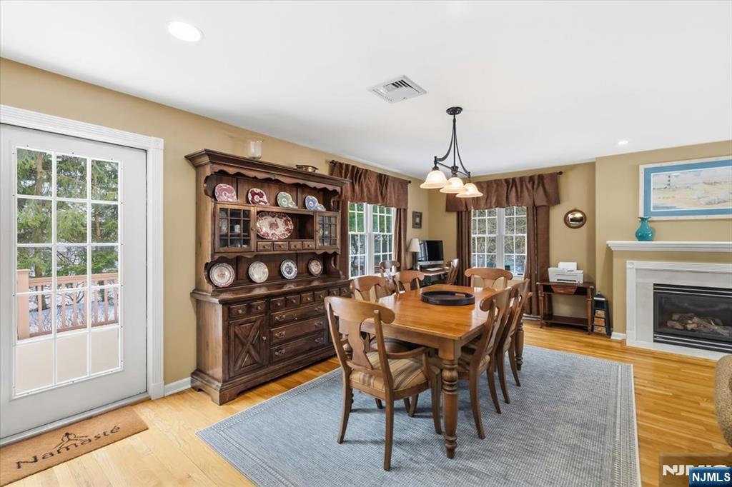 4 Lindeman Avenue Closter, NJ 07624 - Photo 14 of 36 a dining room with furniture a chandelier and wooden floor