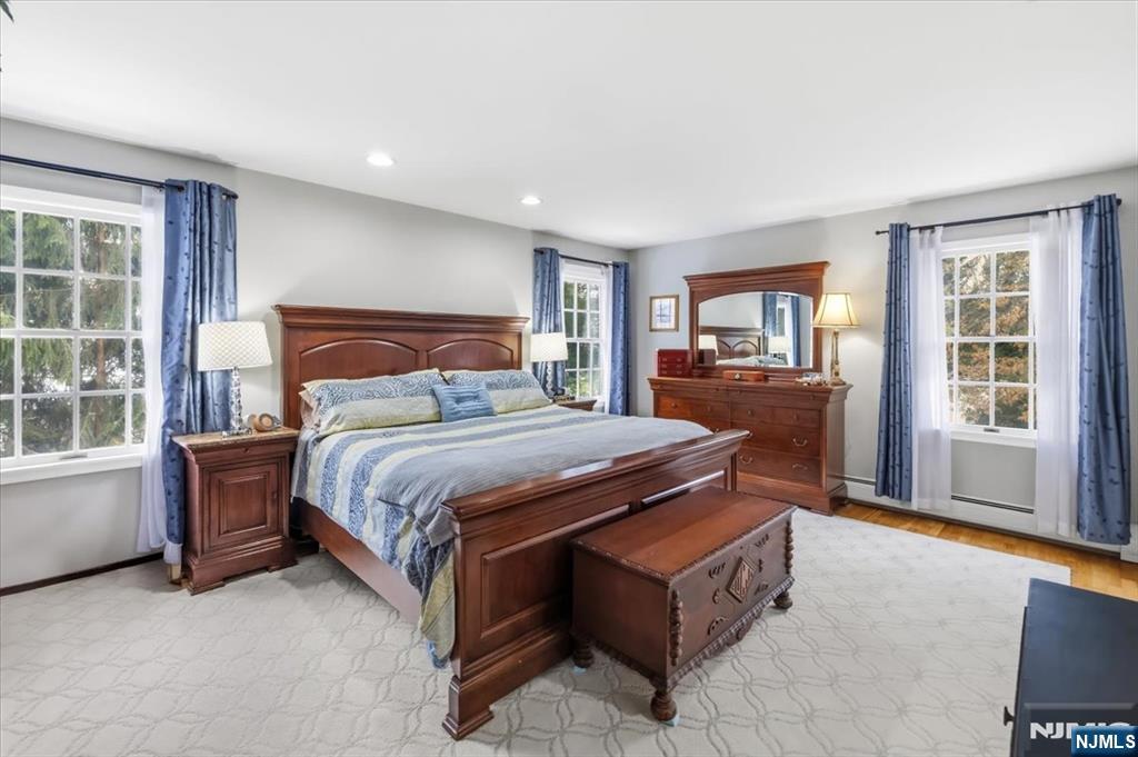 4 Lindeman Avenue Closter, NJ 07624 - Photo 17 of 36 a bedroom with a large bed and a window in it