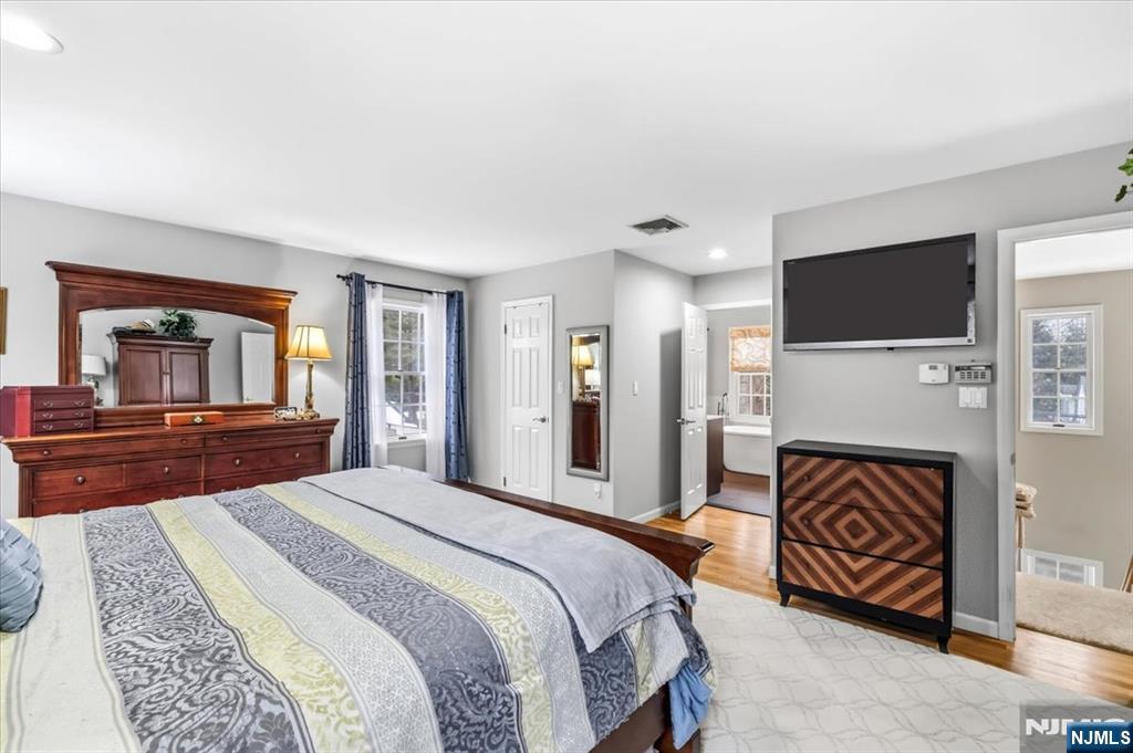 4 Lindeman Avenue Closter, NJ 07624 - Photo 18 of 36 a spacious bedroom with a bed and a television