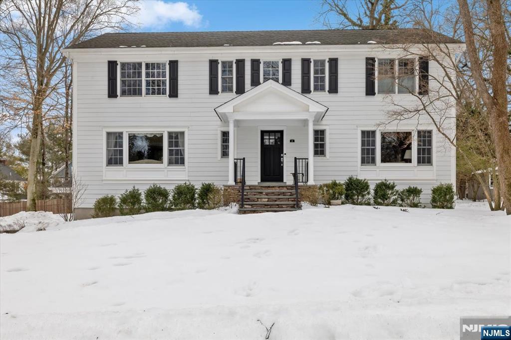 4 Lindeman Avenue Closter, NJ 07624 - Photo 2 of 36 a front view of a house with a yard