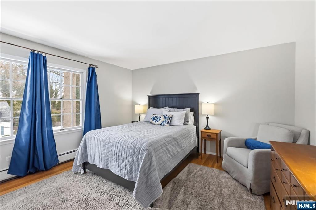 4 Lindeman Avenue Closter, NJ 07624 - Photo 24 of 36 a bedroom with a bed and a dresser