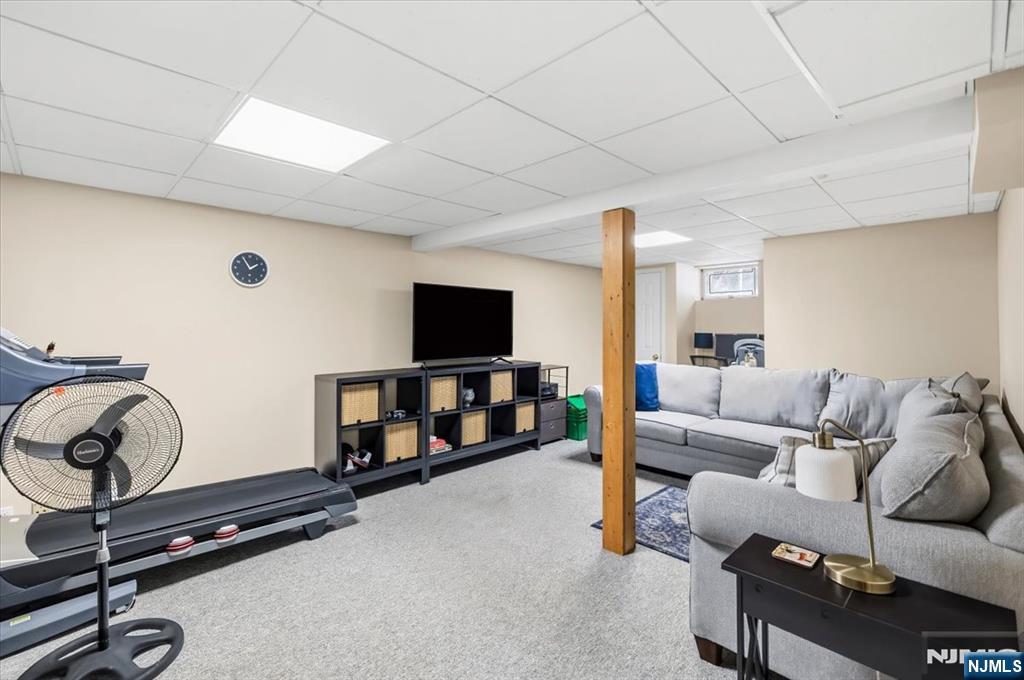 4 Lindeman Avenue Closter, NJ 07624 - Photo 28 of 36 a living room with furniture and a flat screen tv