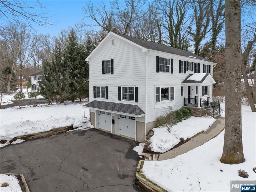 4 Lindeman Avenue Closter, NJ 07624 - Photo 30 of 36 a front view of a house with a yard