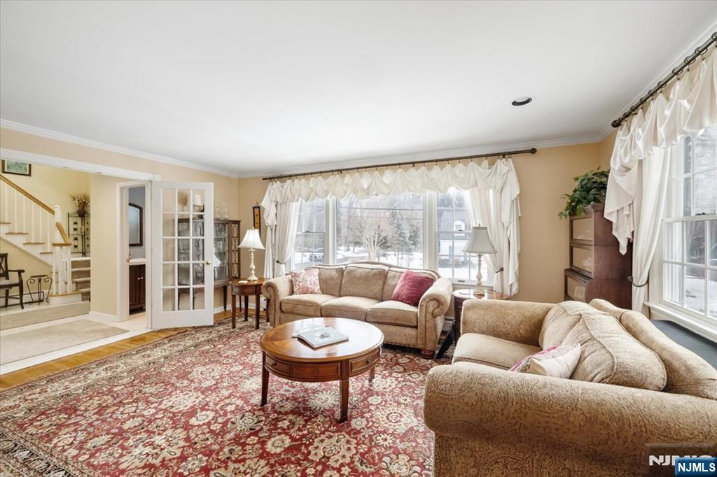4 Lindeman Avenue Closter, NJ 07624 - Photo 5 of 36 a living room with furniture a rug and a large window