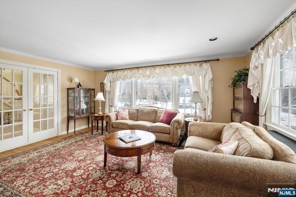 4 Lindeman Avenue Closter, NJ 07624 - Photo 6 of 36 a living room with furniture and a large window