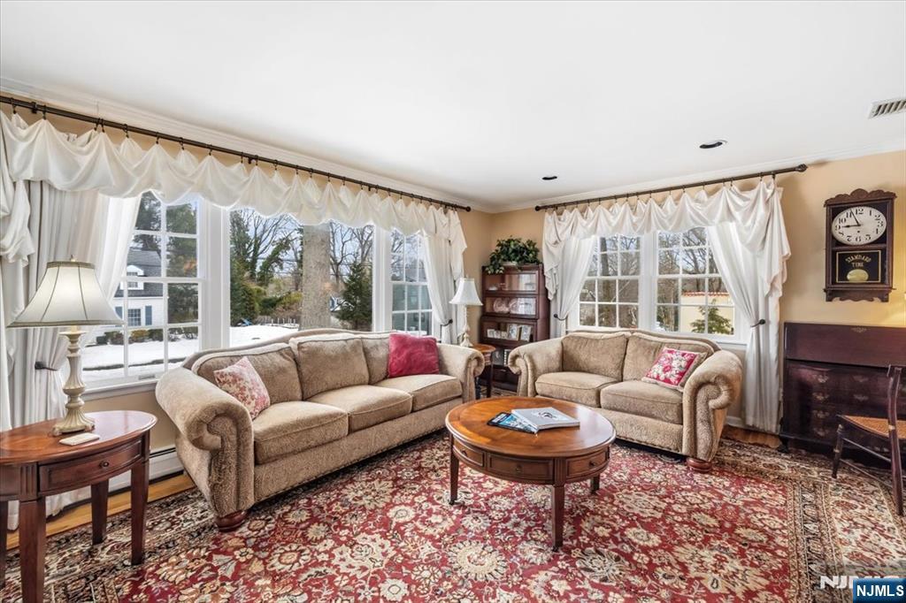 4 Lindeman Avenue Closter, NJ 07624 - Photo 7 of 36 a living room with furniture and a large window