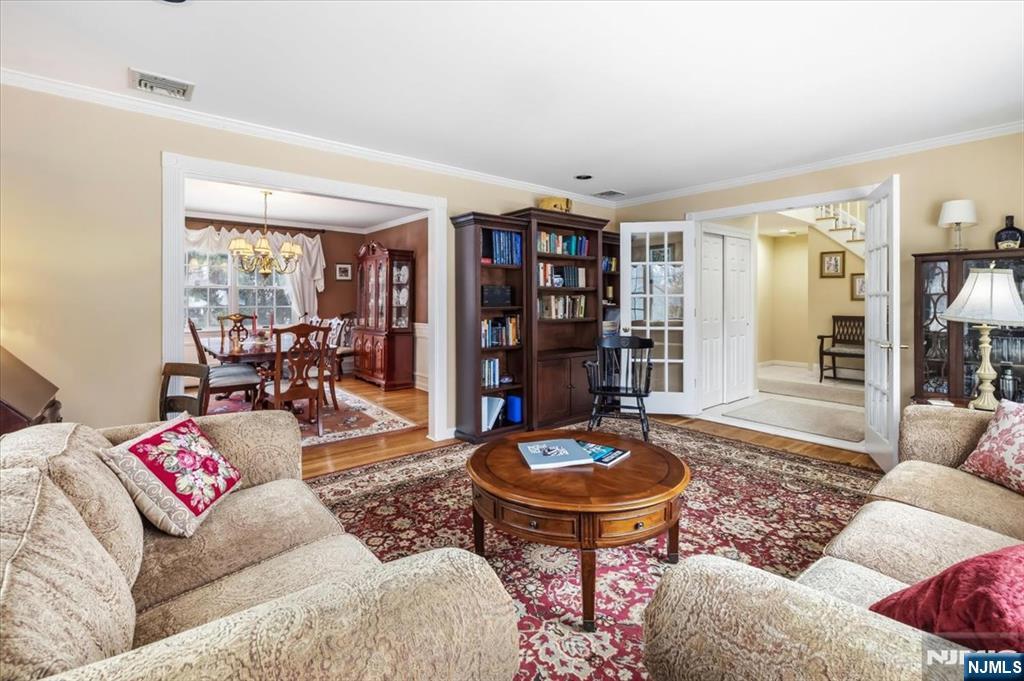 4 Lindeman Avenue Closter, NJ 07624 - Photo 8 of 36 a living room with furniture and a book shelf