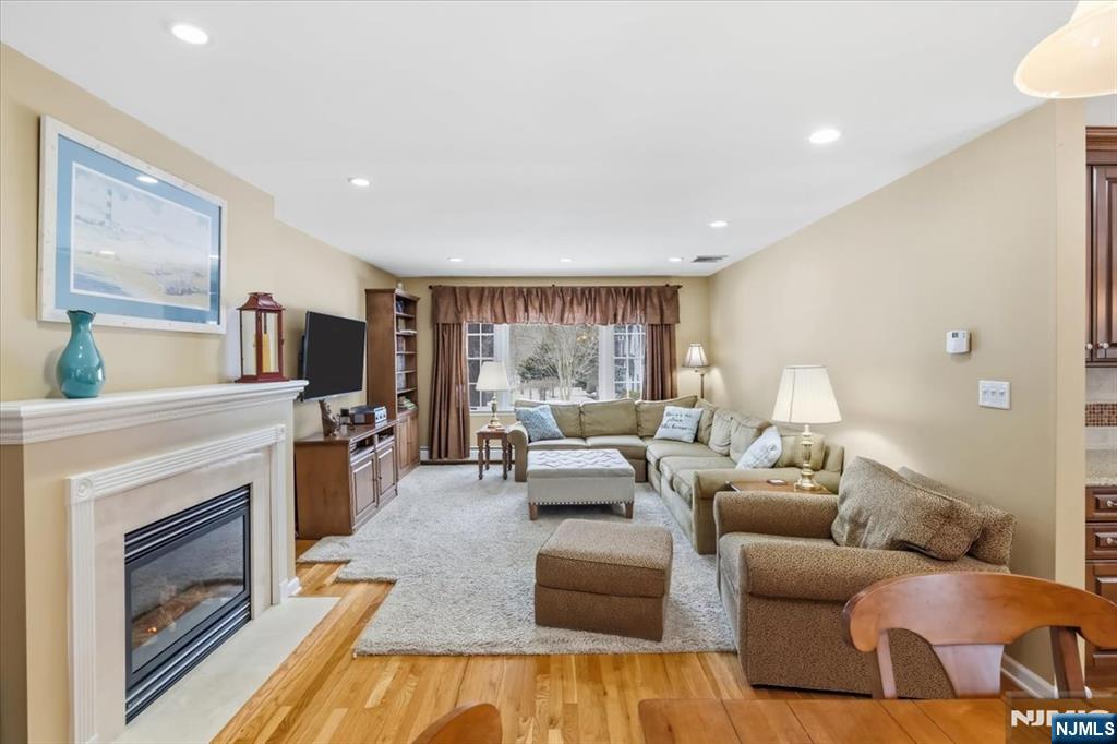 4 Lindeman Avenue Closter, NJ 07624 - Photo 10 of 36 a living room with furniture large window and fireplace