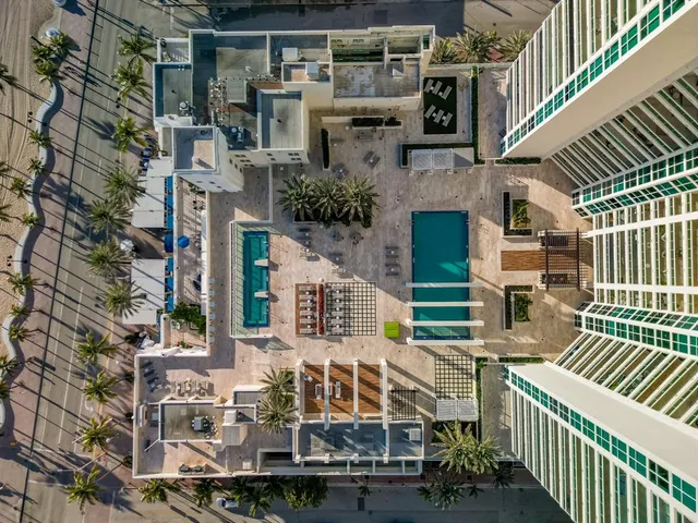 a view of a backyard with sitting area