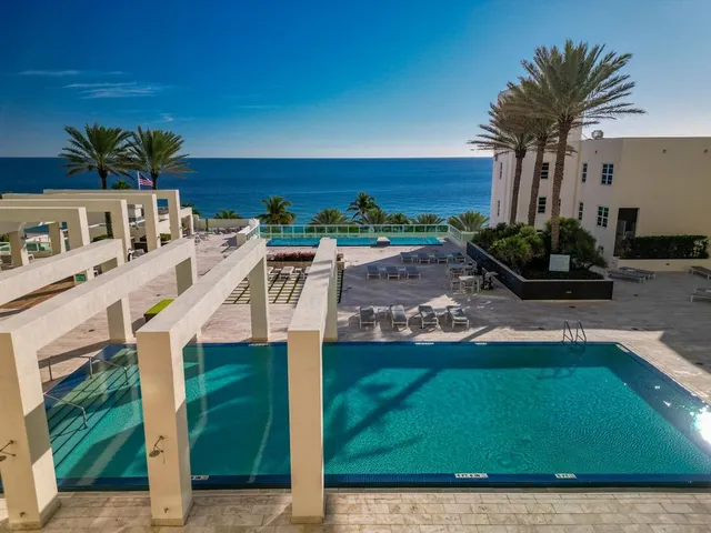 a view of a balcony with chairs
