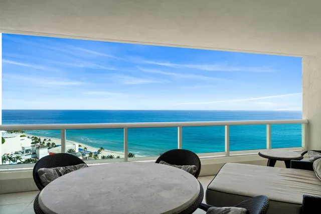 a room with furniture and a large window