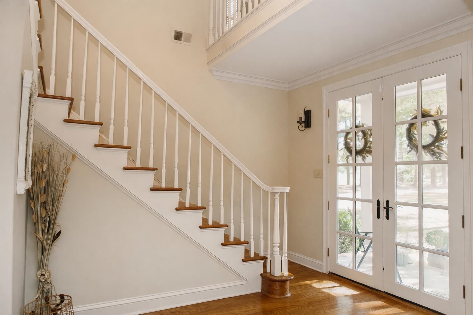 565 Schaeffer Loop Eads, TN 38028 - Photo 6 of 33 a view of staircase with wooden floor and windows