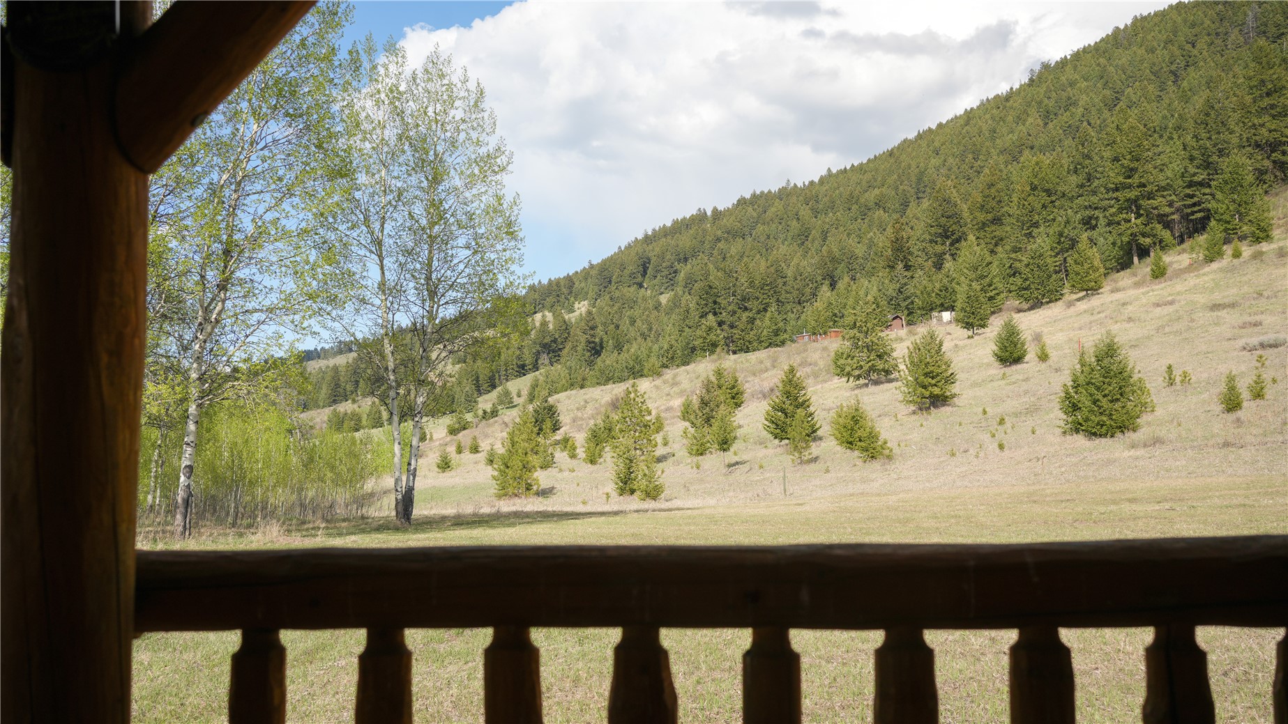 240 Old Railroad Road Oroville, WA 98844 - Photo 9 of 24 a view of a large mountain from a window