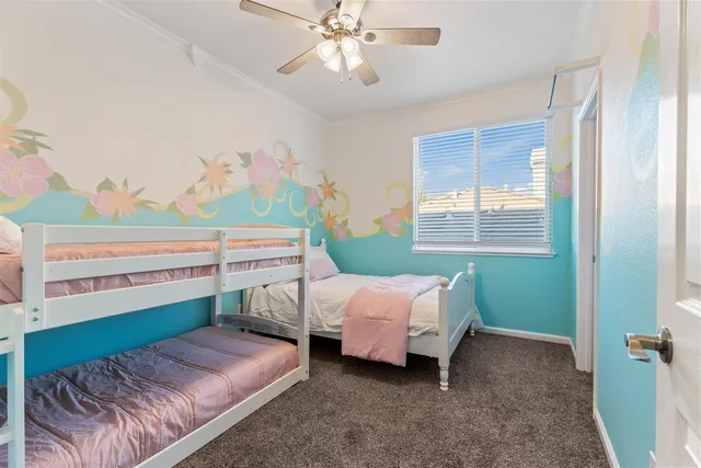 a bed room with a bed and a chandelier