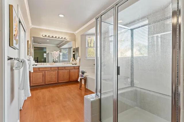 a bathroom with a tub sink and mirror