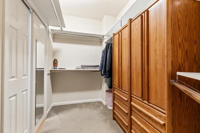 a view of living room with patio furniture and potted plants