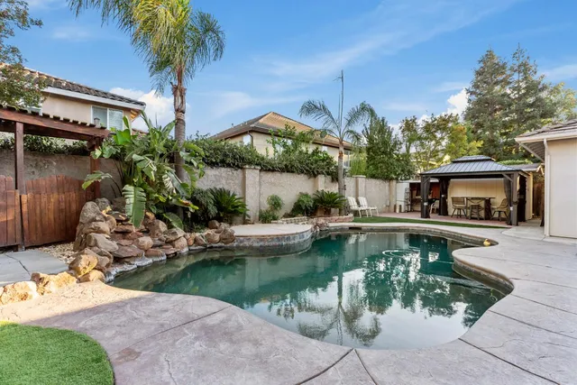 a view of two chairs in the balcony