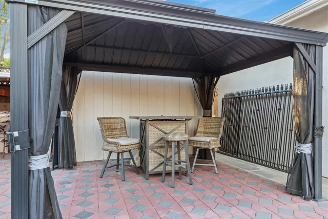 a view of outdoor kitchen and patio