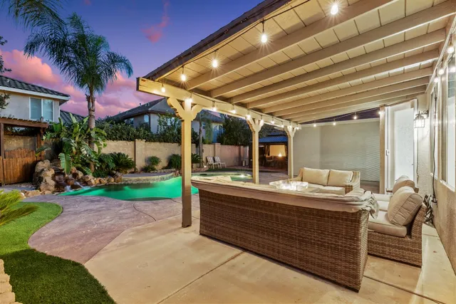 a view of a swimming pool with a patio