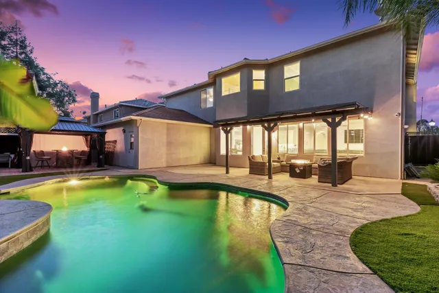 a view of a backyard with a patio