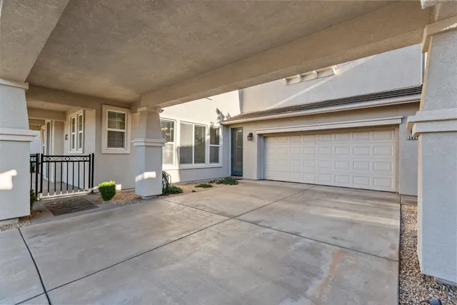 a view of a house with parking area and windows