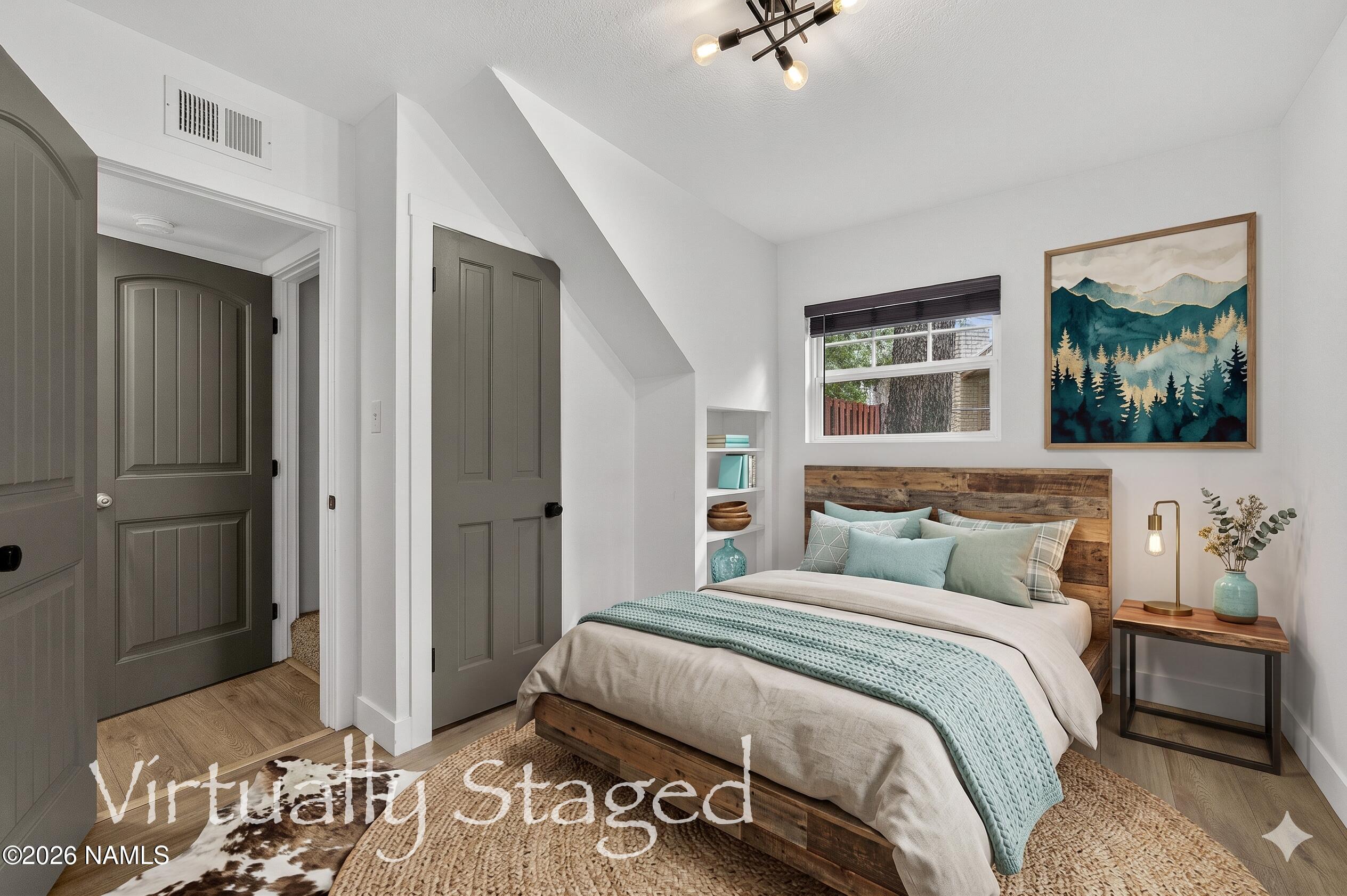 530 East Charles Road Flagstaff, AZ 86001 - Photo 29 of 54 a bedroom with a bed and a mirror