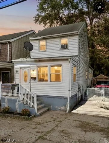 a front view of a house with garage