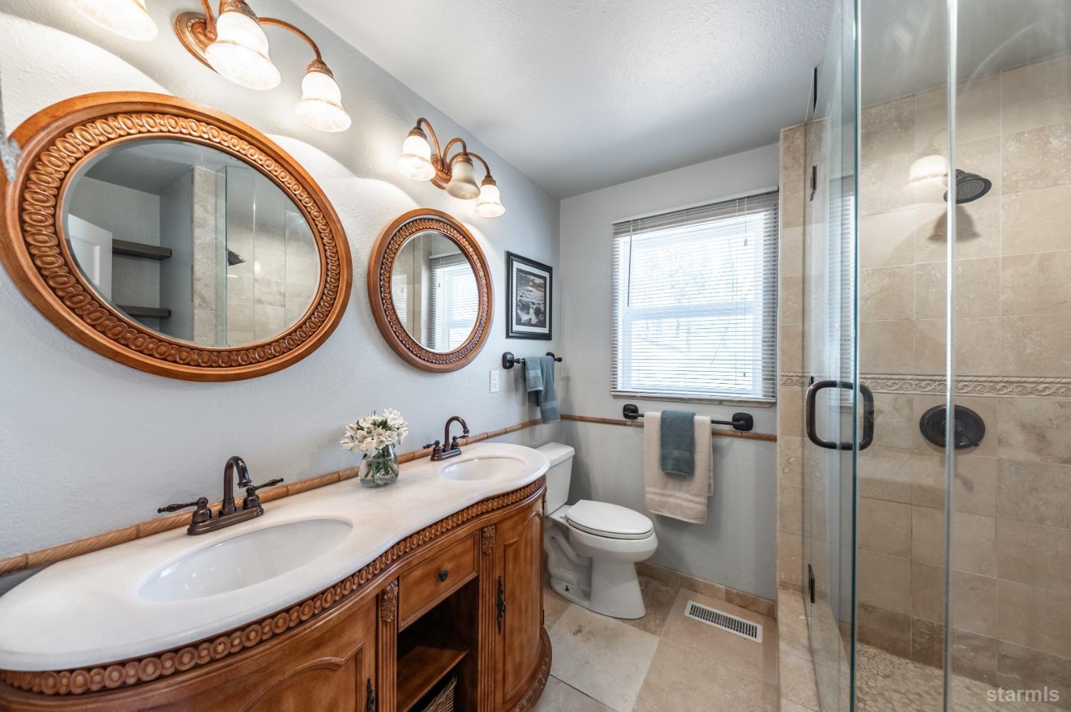 15740 Highway 89 Markleeville, CA 96120 - Photo 12 of 24 a bathroom with a toilet a sink and a mirror