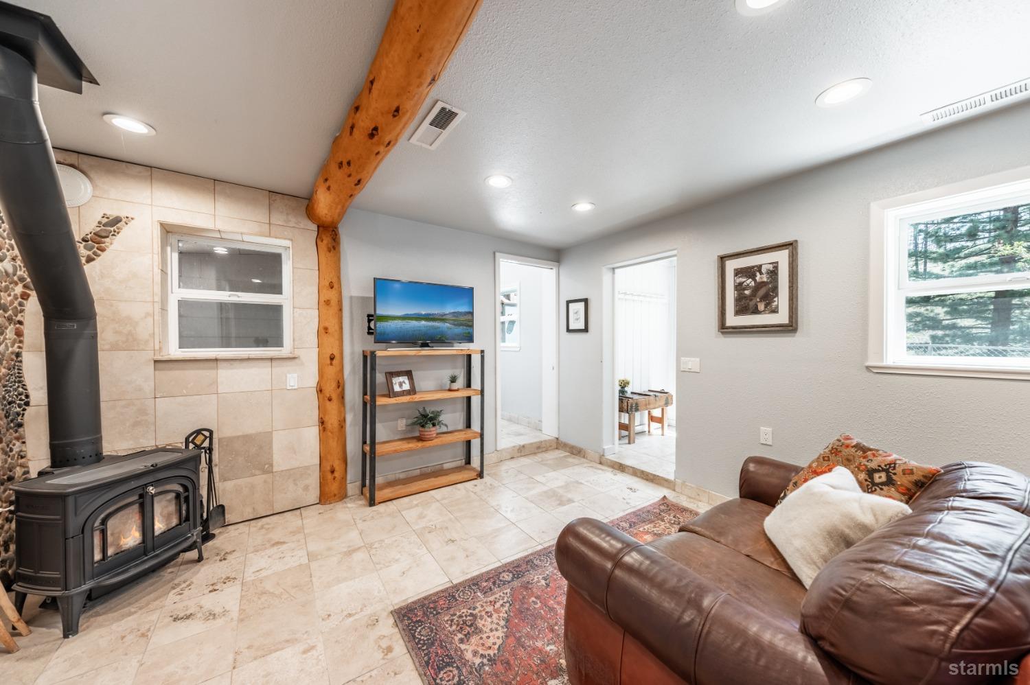 15740 Highway 89 Markleeville, CA 96120 - Photo 14 of 24 a bedroom with furniture and a wooden floor