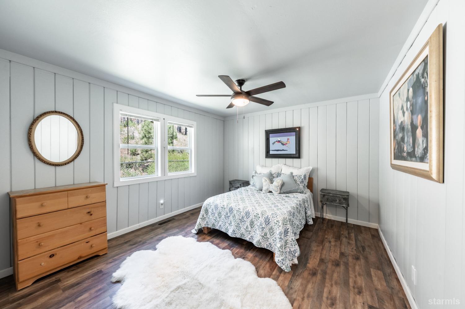 15740 Highway 89 Markleeville, CA 96120 - Photo 15 of 24 a bedroom with a bed and a dresser