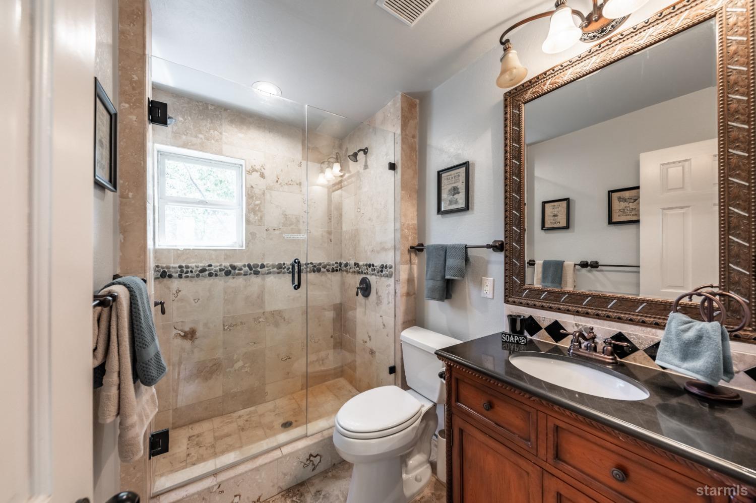 15740 Highway 89 Markleeville, CA 96120 - Photo 19 of 24 a bathroom with a sink toilet and shower