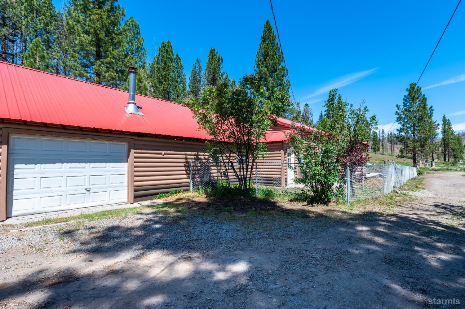 15740 Highway 89 Markleeville, CA 96120 - Photo 20 of 24 a view of a house with a yard and garage