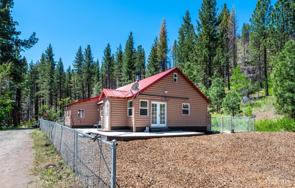 15740 Highway 89 Markleeville, CA 96120 - Photo 2 of 24 a view of house with a yard and potted plants