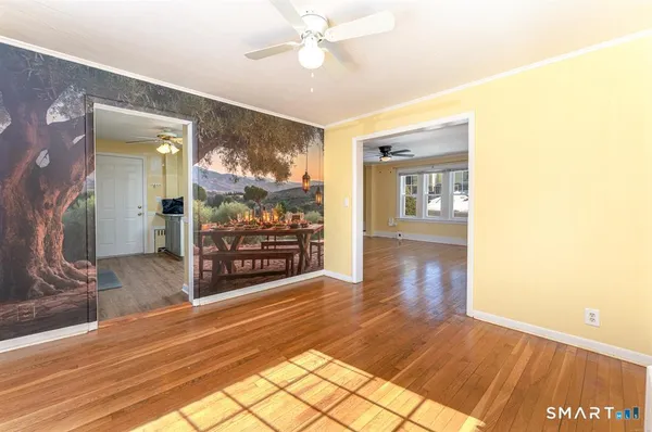 a kitchen with stainless steel appliances granite countertop a refrigerator a sink dishwasher a stove top oven a refrigerator with island and chairs