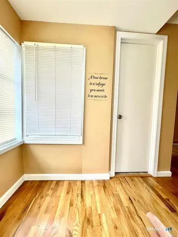 a view of a room with a wooden floor