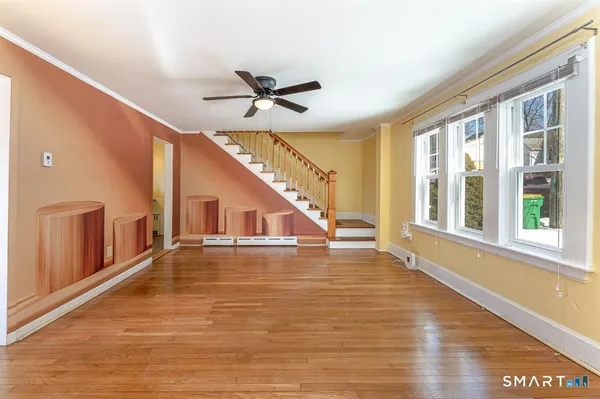a view of an entryway with wooden floor