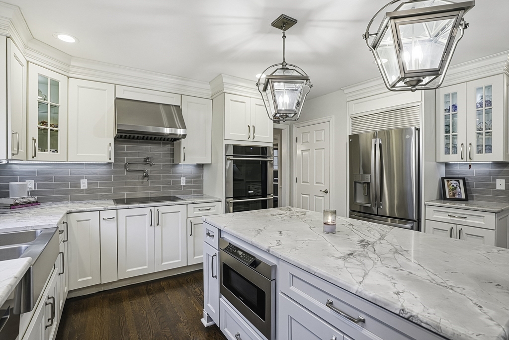 20 Thayer Road Mendon, MA 01756 - Photo 11 of 42 a kitchen with stainless steel appliances granite countertop a sink a stove and cabinets