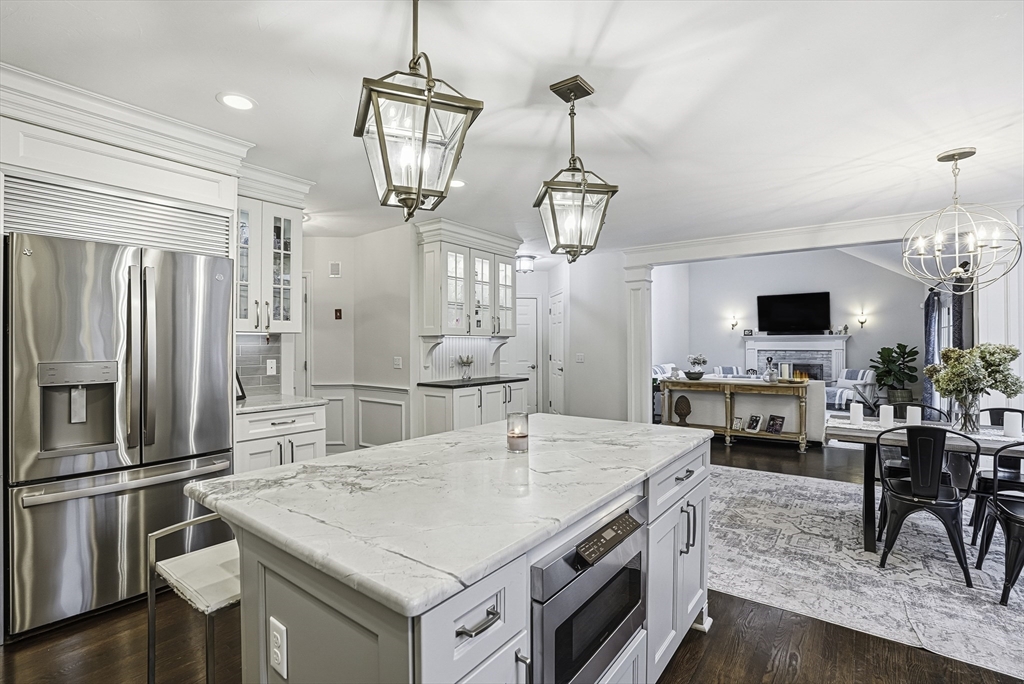 20 Thayer Road Mendon, MA 01756 - Photo 12 of 42 a kitchen with stainless steel appliances a center island refrigerator stove and microwave