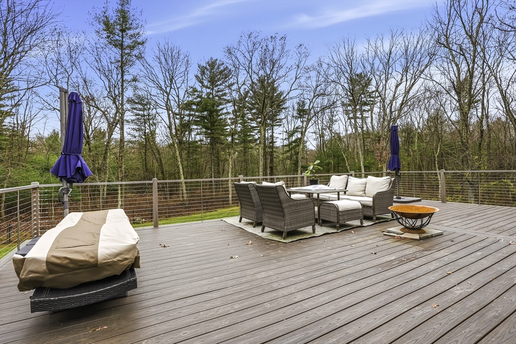 20 Thayer Road Mendon, MA 01756 - Photo 39 of 42 a view of a roof deck with couches and wooden fence
