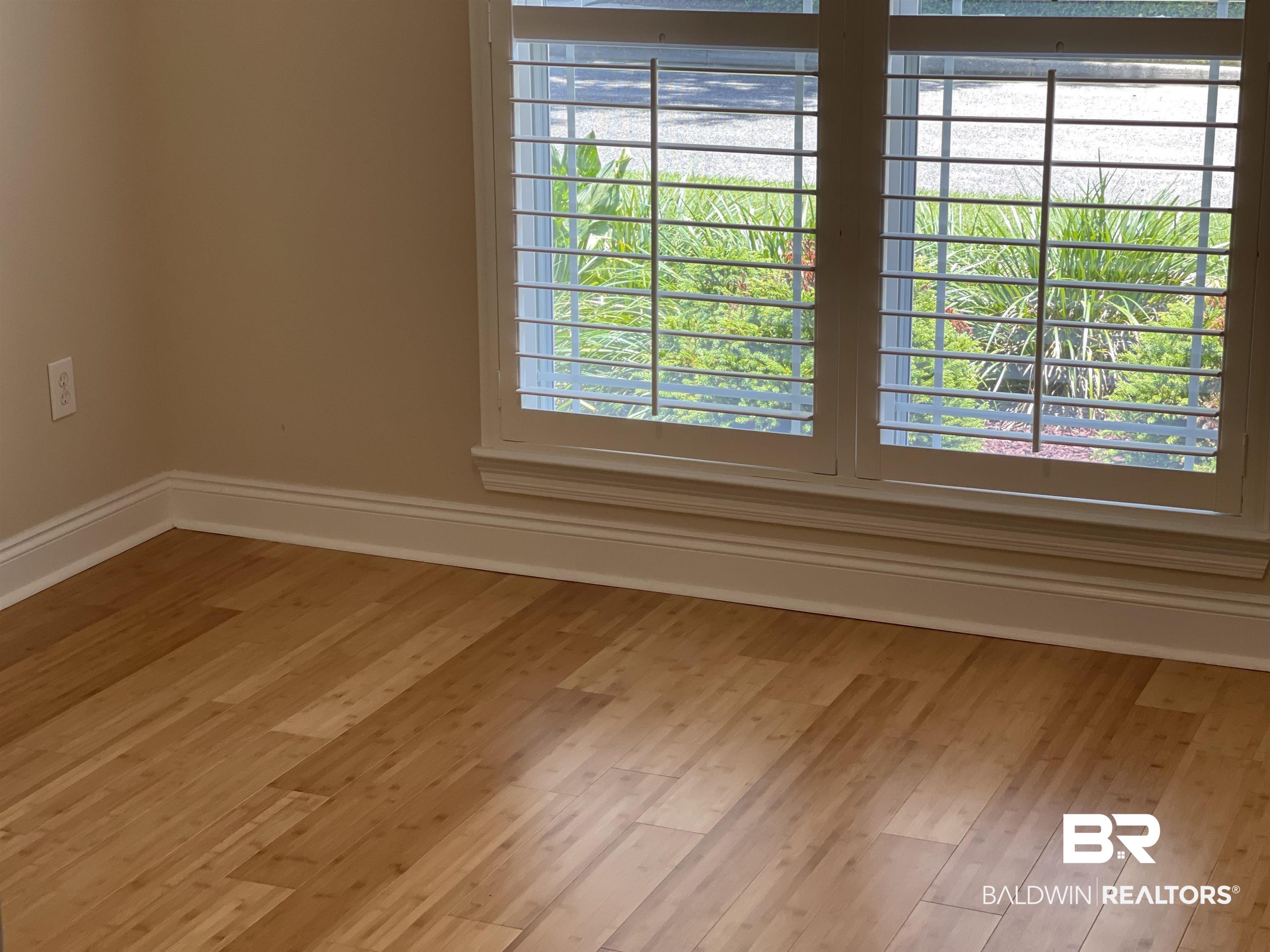 210 Savannah Circle Foley, AL 36535 - Photo 12 of 18 Unfurnished room featuring a wealth of natural light and hardwood / wood-style floors