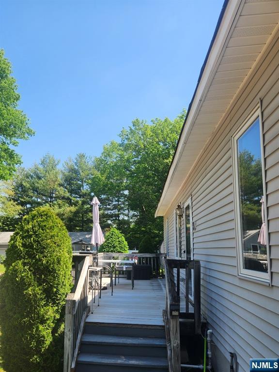 1 Cedar Lane Paramus, NJ 07652 - Photo 4 of 13 a view of a patio with chairs and potted plants