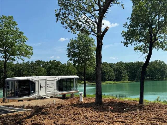 a big yard with lots of green space and trees