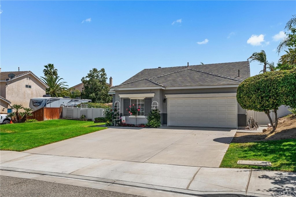 20803 Millbrook Street Riverside, CA 92508 - Photo 1 of 44 a front view of house with yard and green space