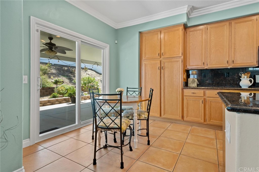 20803 Millbrook Street Riverside, CA 92508 - Photo 13 of 44 a kitchen with stainless steel appliances granite countertop a stove a sink and a microwave