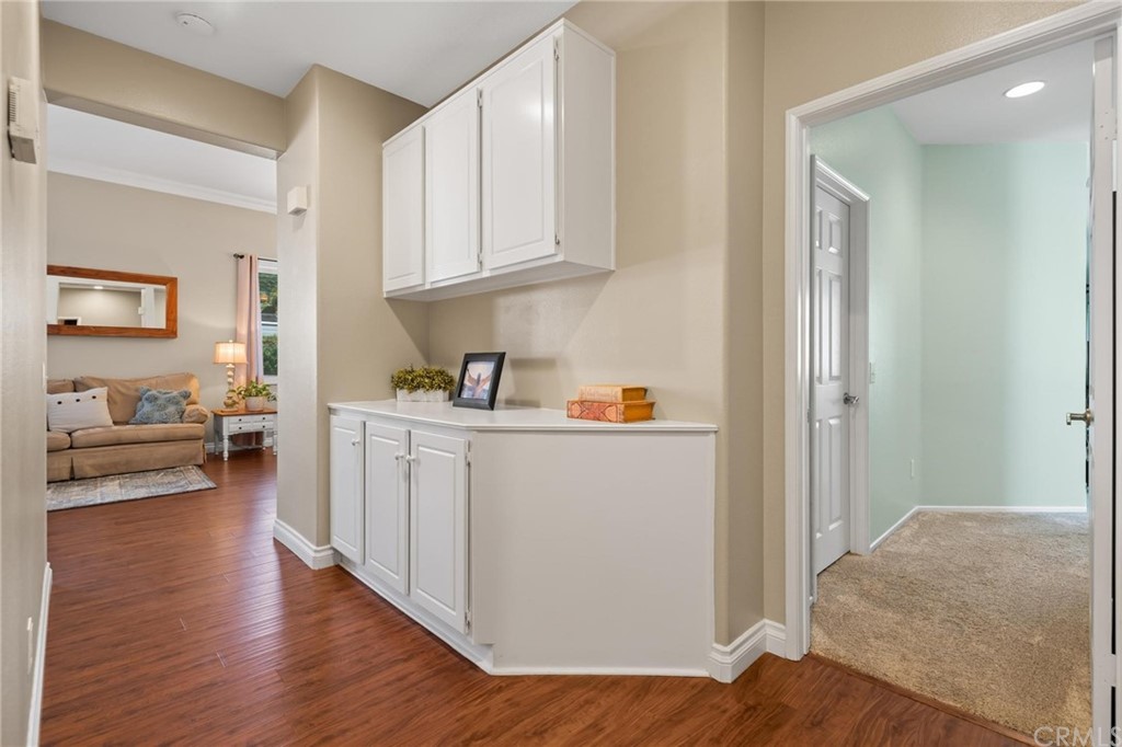 20803 Millbrook Street Riverside, CA 92508 - Photo 17 of 44 a view of a bedroom with wooden floor and furniture